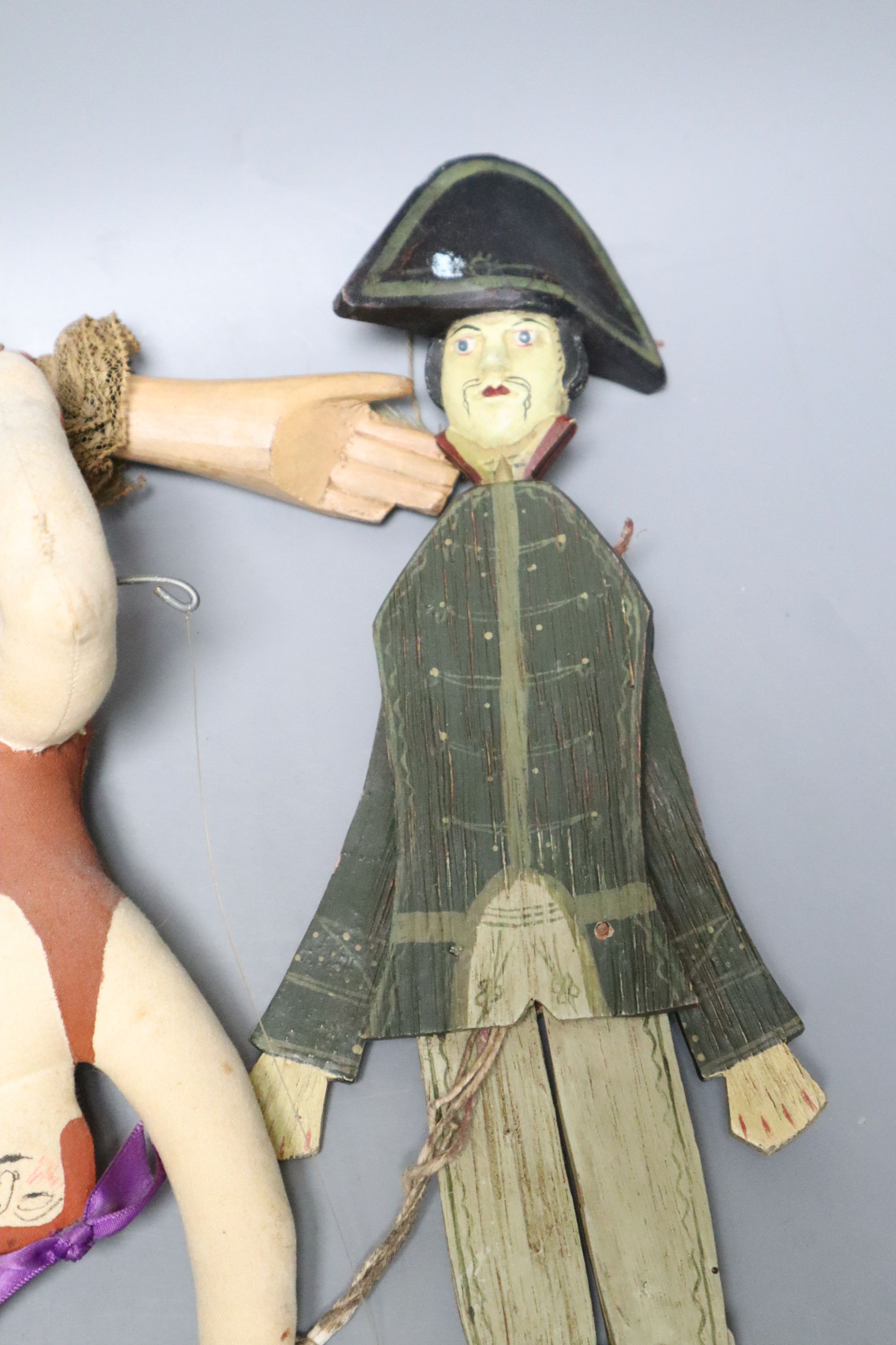 A Spanish / South American articulated marionette and two other toys